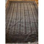 Bokhara olive ground rug, multi elephant pad medallions to centre, within reticulated borders,