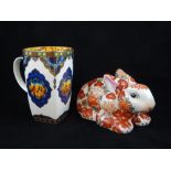 Chinese Imari pattern ceramic rabbit, 19cm, together with a mug.