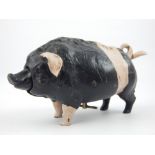 Cold painted cast metal table bell modelled as a saddle-back pig, 17cm.