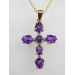 9ct yellow gold amethyst cross pendant on 9ct fine chain.