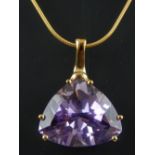 9ct yellow gold trapeze cut amethyst pendant on 9ct fine link chain.