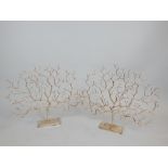 Pair of contemporary gilt and silvered ornaments of winter trees.