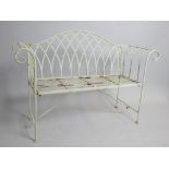 Contemporary metal garden bench, scroll arms, strip seat, pad feet.