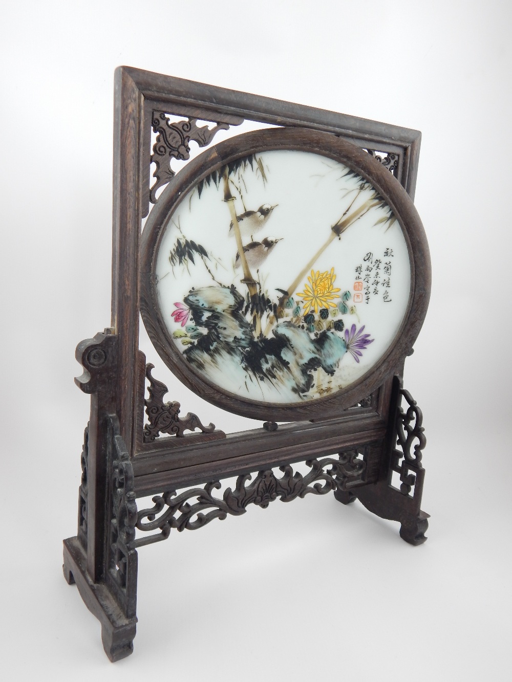 Chinese painted porcelain screen, set in carved and pierced wooden frame, 35cm h.