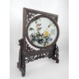 Chinese painted porcelain screen, set in carved and pierced wooden frame, 35cm h.