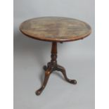 19th C mahogany snap top table, turned column, tripod base with pad feet, 72cm dia.