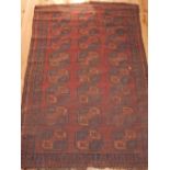 Bokhara rug, decorated with three elephant pad medallions within serrated borders, 163 x 117cm.