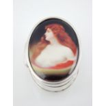 Oval silver pill box, the cover with an image of a lady, the body stamped 925.