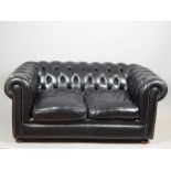 Black Chesterfield, traditional button back leather sofa, gunmetal tacks, bun feet, approx. 153cm w.