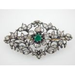 An antique Art Nouveau emerald and diamond spray brooch,