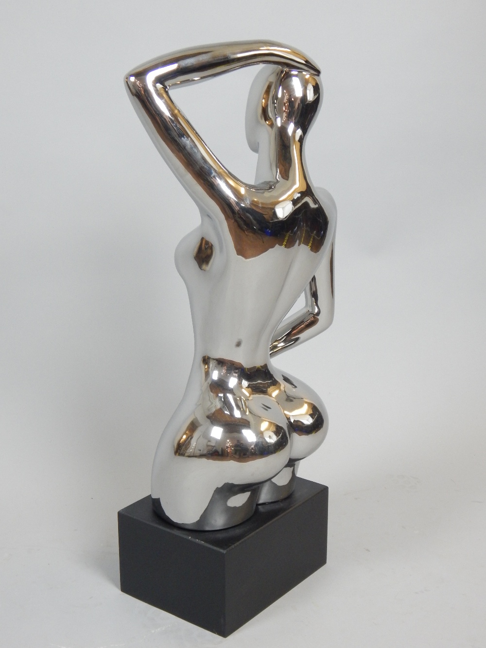 Contemporary silvered ceramic sculpture, female nude on rectangular ebonised plinth, 75cm H. - Image 2 of 2