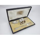 George V silver Christening fork and spoon Sheffield 1913 cased with an associated silver napkin