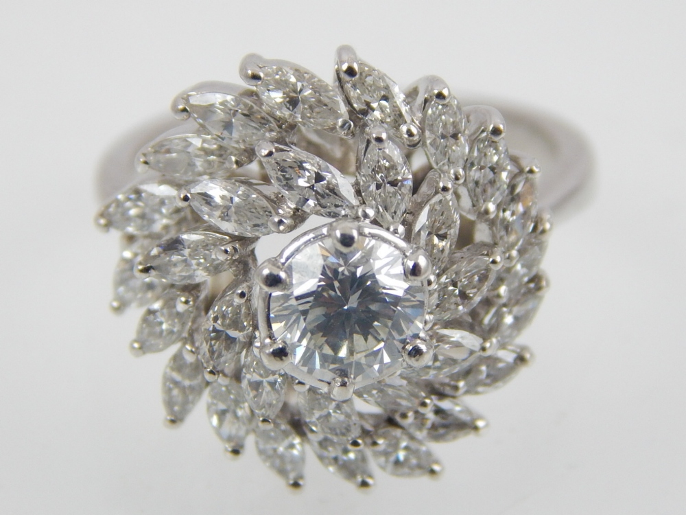 A diamond cluster, three tiered ring in 18ct white gold.