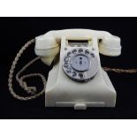 GPO ivory Bakelite 328 model telephone, incorporating two push button switches at the cradle.