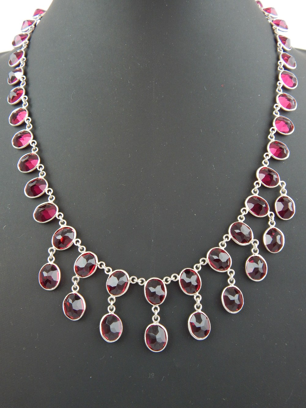 Contemporary silver and red Swarovski crystal necklace set with oval faceted stones, 46 cm l.