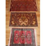 Chinese red ground rug, decorated with dragon amongst scrolling foliage,