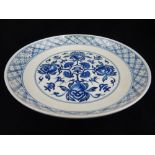 Chinese blue and white porcelain dish, floral design to centre, six character mark to base,