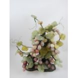 Chinese hardstone carving modelled as a bunch of grapes, 30cm h.