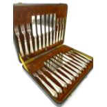 Cased set of twelve late Victorian silver plated and steel dessert knives and forks with embossed