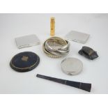 Collection of compacts, lipstick holder, cigarette holder and expanding bangle bracelet.