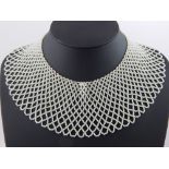Bead collar, expanding lattice decoration, 12.5cm gap at neck, and coral necklaces.