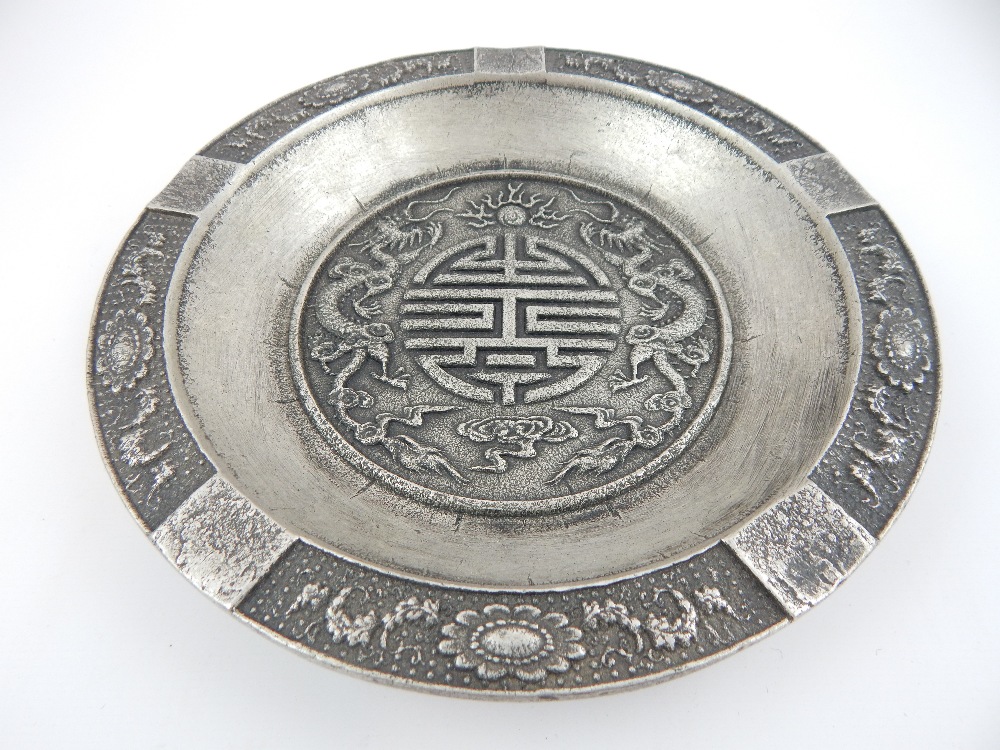 Chinese white metal tray, the centre with raised decoration of dragons chasing pearl,