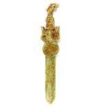 An archaic form dragon handled ceremonial Chinese dagger in ochre spotted celadon jade, 27.5cm