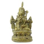 An Indian antique bronze figure of a deity on throne with attendants.
