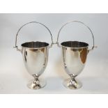 Pair of plated urn shaped wine coolers with swing handles on circular bases 30cm h. (2)