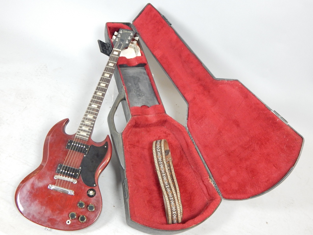 Gibson SG Special guitar, no. 99147491, the mahogany body with a Heritage Cherry finish, within a