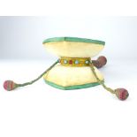 A Tibetan bone, leather and gilt metal meditation drum, 19cm max. length.