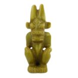 A rare sage green carved jade figure of a Chinese demon, in the early Han Dynasty style, 16cm high.