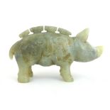 A Chinese carved all round green/grey jade figure of a standing pig, in the style of the Ch'ing