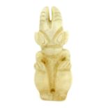 A rare translucent carved quartz or ''mutton fat'' Chinese jade figure of a crouching horned