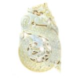 An elaborate Sung style carved white veined jade dragon pi roundel, carved both sides with ''