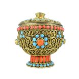 An antique Sino-Tibetan gilt metal footed cup and cover with blind filigree work enriched by coral