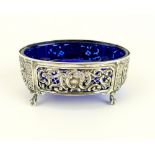 Large Victorian silver open salt cellar with pierced and scroll sides, blue liner, ball and claw