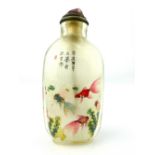 A Chinese snuff bottle internally painted with Shubunkin and Fantail fish amongst pond weed, signed,