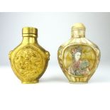 A Chinese gilt metal snuff bottle and an engraved and polychromed mother-of-pearl snuff bottle,