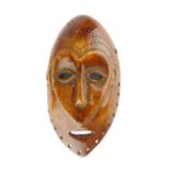 A rare late 18th/early 19th C African carved ivory ceremonial mask, 14 x 8cm.