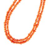 A naturalistic coral necklace a single strand of interlocking coral pieces. Length 100cm / 40”.