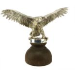 A Silvered bronze statue of an American bald eagle cast in detail to show the eagle with its wings