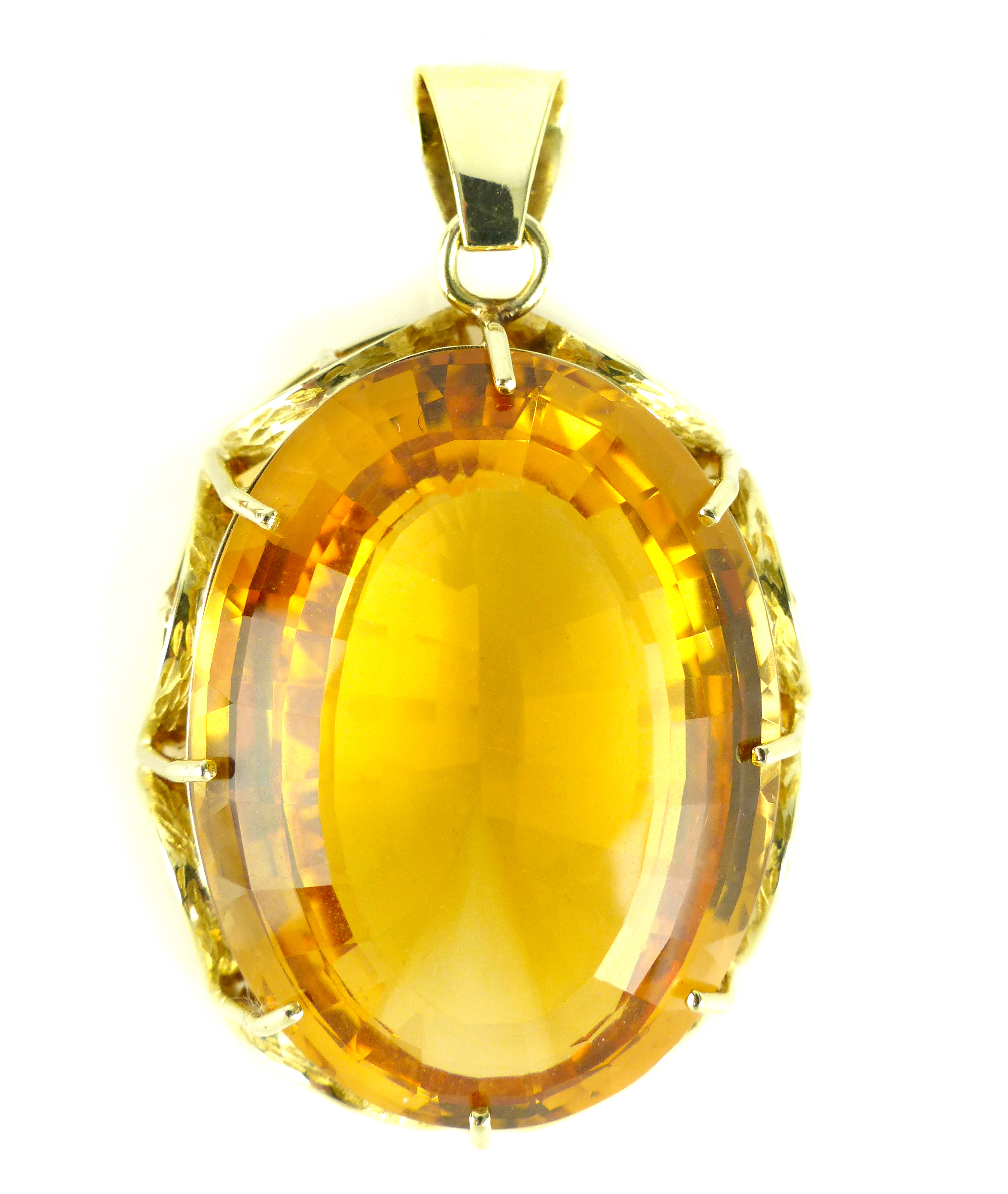 A large citrine / Cairngorn pendant claw set in yellow gold,