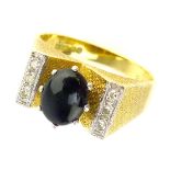 A gentleman's diamond and garnet ring in 18ct yellow gold,