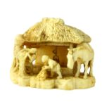 Antique 19th Century Japanese carved ivory netsuke depicting a horse and two men at work in front