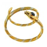 A vintage ladies snake bangle in 18ct gold, the flexible body stretching to fit the wrist.