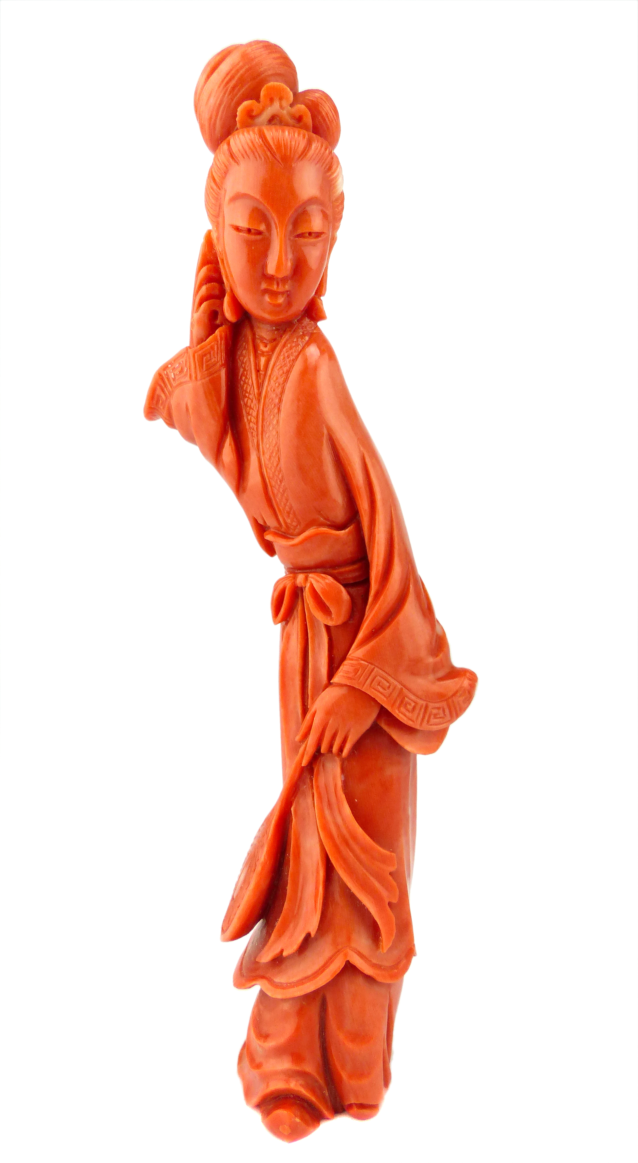 An Antique late Qing dynasty Chinese carved coral figure depicting a lady in traditional dress.