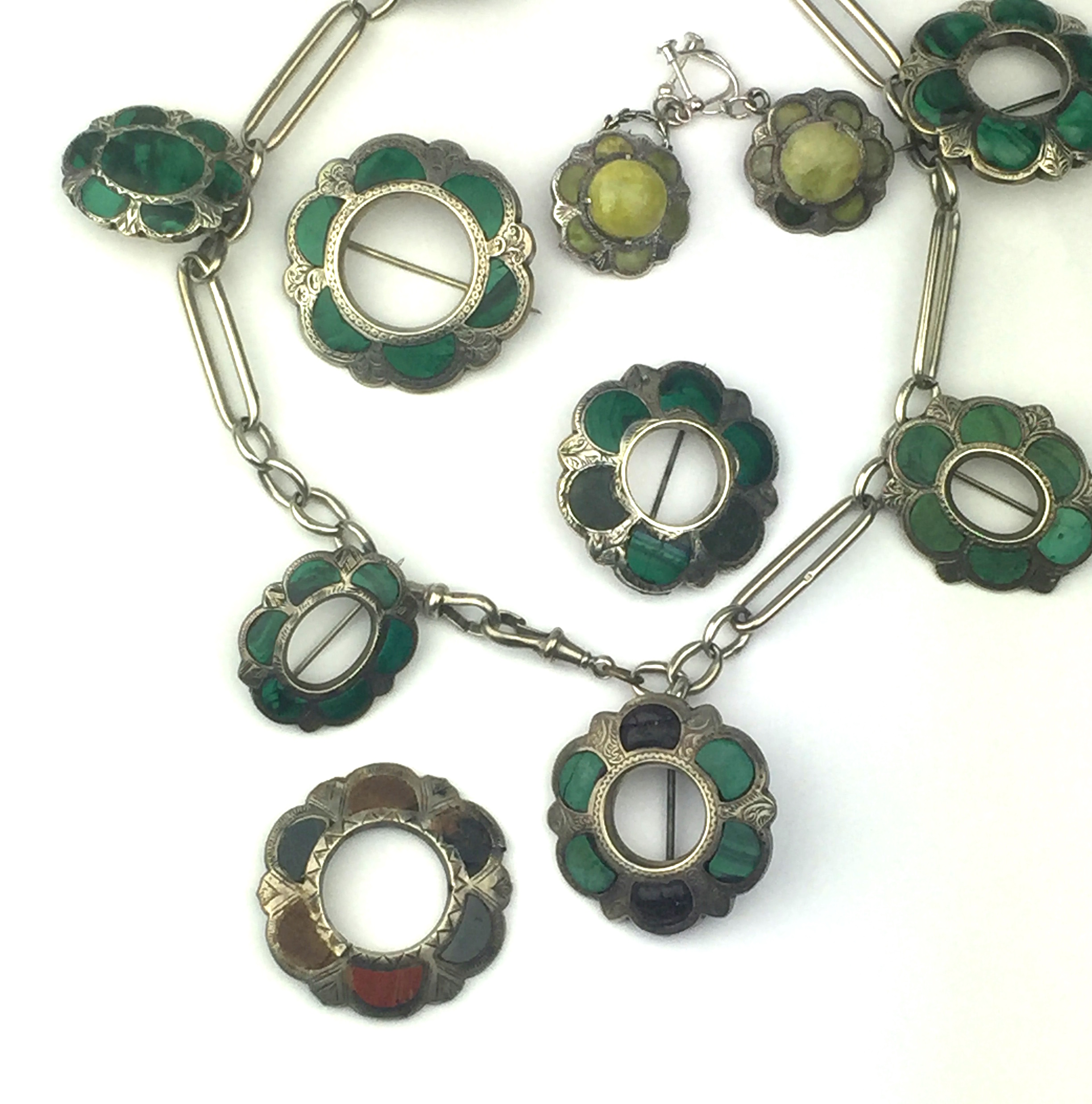 A malachite necklace set in sterling silver,