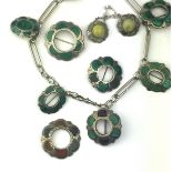 A malachite necklace set in sterling silver,