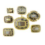 A collection of antique Victorian / Edwardian mourning brooches in gold and gilt metal,